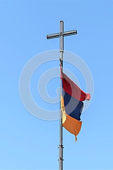 Armenia, Khor Virap, September 2021. Armenian flag on a pole with a cross.