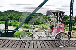 Tricycle thai style on Bridge over Pai River at Pai at Mae Hong Son Thailand