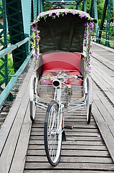 Tricycle thai style on Bridge over Pai River at Pai at Mae Hong Son Thailand