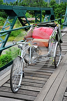 Tricycle thai style on Bridge over Pai River at Pai at Mae Hong Son Thailand