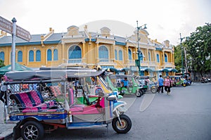 Tricycles and Tuk Tuks line up waiting to pick up tourists in front of the Golden Press store near the Grand Palace in Bangkok, Th