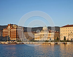 Trieste, Italy, Rive at sunset with neo-classical Carciotti pala