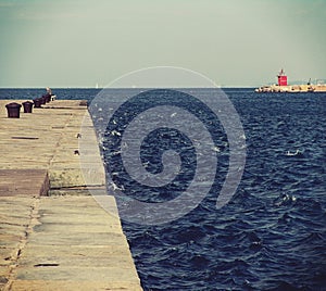 Trieste, Italy: Audace pier with raged waves photo