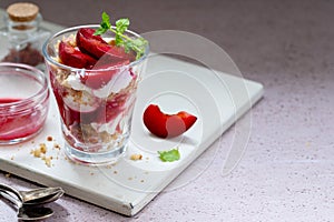 Trifles in layers with red plums and whipped cream homemade dessert