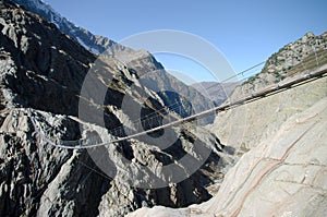 Trift bridge in Alps photo
