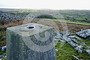 Trig Point Marker overlooking the North Wales Countryside and Ceredigion Bay.