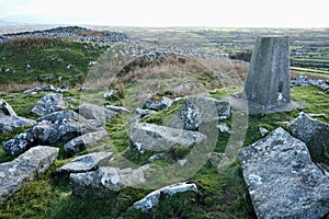 Trig Point Marker overlooking the North Wales Countryside and Ceredigion Bay.