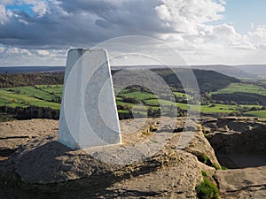 Trig point on Roseberry Topping, over Captain Cooks Monument, North York Moors