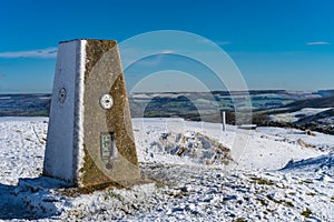 Trig Point at the summit of Cleeve Hill on the Cotswold Way, Gloucester UK in winter photo