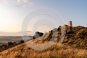 Trig point on top of The Roaches at sunset in the Peak District National Park