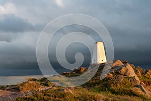 Trig point on top of The Roaches at sunset in the Peak District National Park