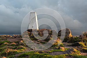 Trig point on top of The Roaches at sunset in the Peak District National Park