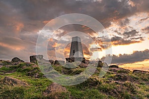 Trig point on top of The Roaches at sunset in the Peak District National Park