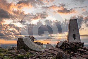 Trig point on top of The Roaches at sunset in the Peak District National Park