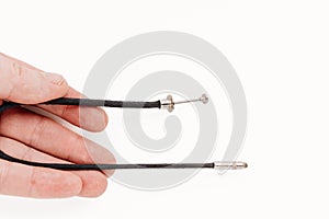 Trigger cable in the hand on a white background. photo equipment.