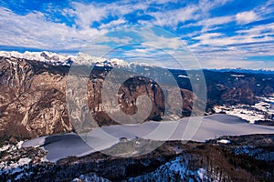 Triglav mountain above Bohinj lake valley in winter time