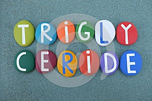 Triglyceride, an ester derived from glycerol and three fatty acids composed with multi colored stone letters