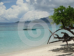 Trimaran at paradise tropical island beach, Coron, Philippines