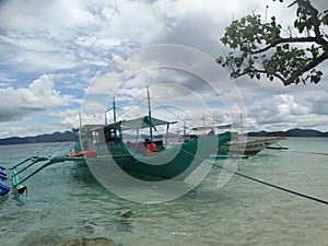 Trimaran at paradise tropical island beach, Coron, Philippines