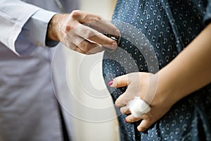 A trimester pregnant woman checking with doctor