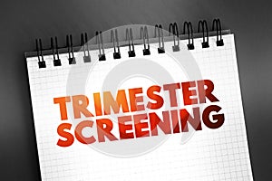 Trimester Screening - test, which helps in early detection of an abnormality in the unborn fetus, text concept on notepad