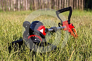 Trimmer on the green lawn in the garden