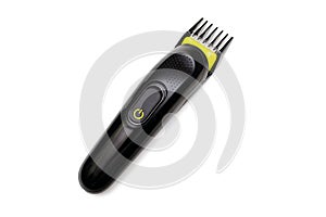 A trimmer razor for cutting and modeling hair lies on a white isolated background