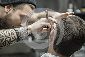 Trimming beard in barbershop