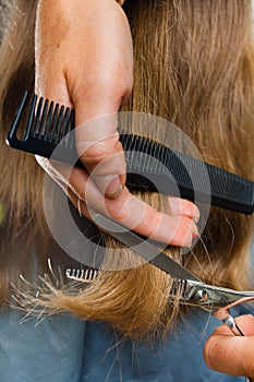 Trimming hair with scissors