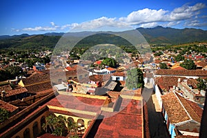 Trinidad city, Cuba. Sunny landscape with tiled roofs and mountains outside the city