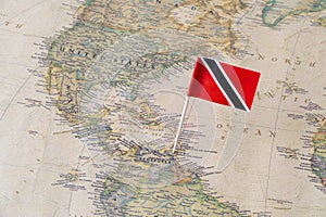 Trinidad and Tobago flag pin on a world map photo