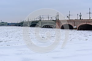 Trinity Bridge over frozen Neva River. Saint Petersburg. Russia