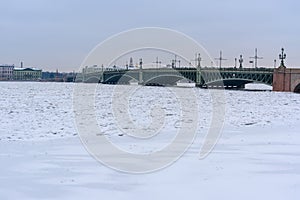 Trinity Bridge over frozen Neva River. Saint Petersburg. Russia