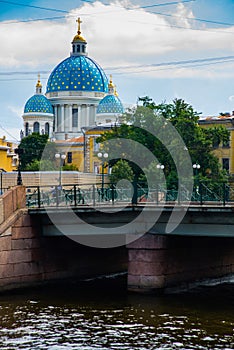Trinity Cathedral, view of Kryukov canal and bridge. Blue domes with yellow stars. Russia, St. Petersburg