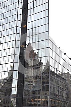 Trinity Church Reflection on a Modern Glass Skyscraper from Boston downtown in Massachusettes State of USA