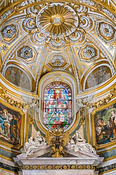 The Trinity in the stained glass of the Church of Santa Maria dell`Anima, in Rome, Italy.