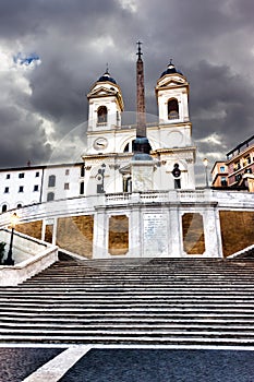 The TrinitÃ  dei Monti church on the Spanish steps before the rain