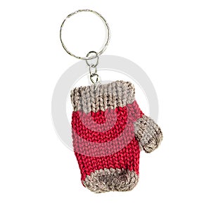 Trinket as a knitted mitten isolated on a white background. concept of handiwork and crafts for the new year