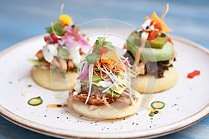 trio of chalupas with various toppings, close-up