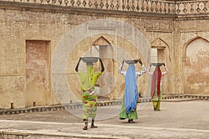 Trio of construction workers in Jaipur, India