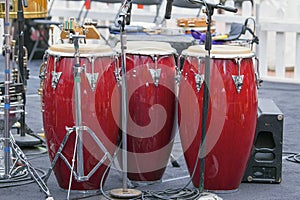 Trio of Red Conga Drums
