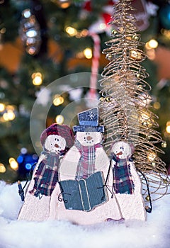 Wooden snowman trio sing carols