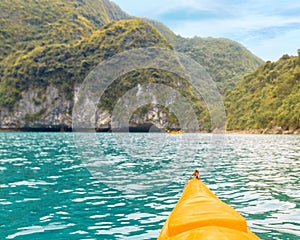 Trip on colourful kayak