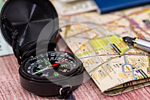 map, compass, passport and euro money.