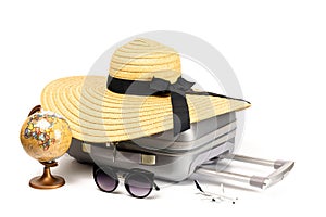 Trip isolated. Womens accessories traveler: suitcase, straw hat, sunglasses, toy plane and globe isolated on white background with