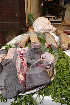 Tripe, hooves and meat  in a butcher shop