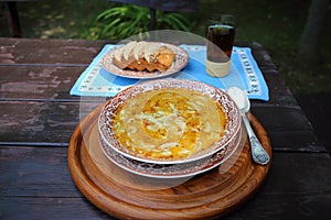 Tripe soup on a rustic table