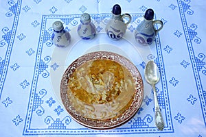 Tripe soup on a rustic table