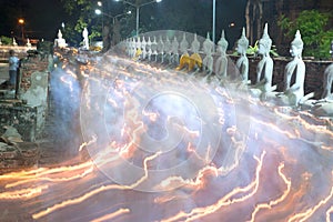 Triple circumambulation at Wat Yai Chai Mongkol temple in Thailand. photo