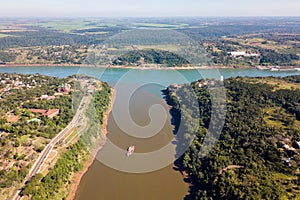 Triple Frontier, tri-border junction of Paraguay, Argentina and Brazil. Iguazu and Parana rivers confluence. Aerial drone photo.